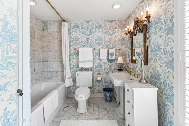 bathroom with vanity, toilet, marble finish floor, shower / bath combo with shower curtain, and wallpapered walls