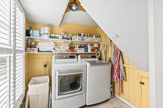 washroom with laundry area, marble finish floor, and washer and dryer