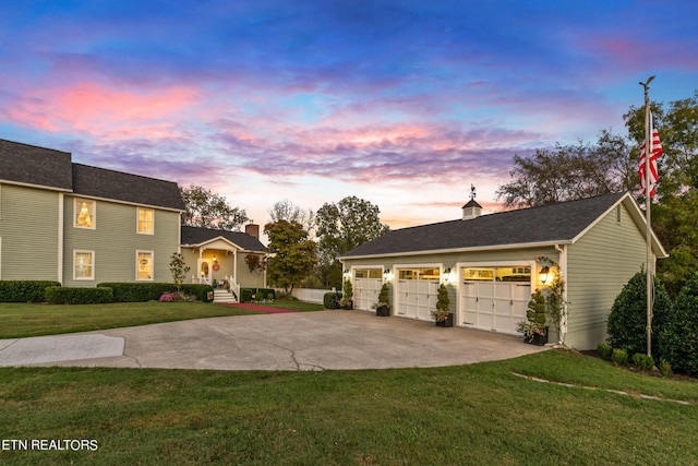 view of front of home featuring a lawn, driveway, and a chimney