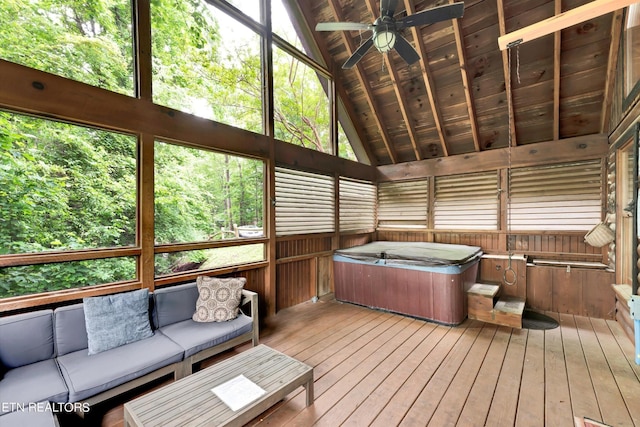 sunroom / solarium featuring ceiling fan, a hot tub, and outdoor lounge area