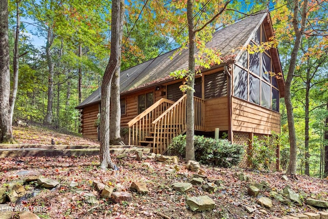 2349 Courtney Ln, Sevierville, TN 37876 - view of side of property featuring roof with shingles, stairs, and a sunroom