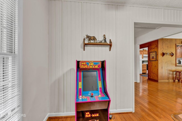 3178 N Clear Fork Rd, Sevierville, TN 37862 - recreation room with wooden walls, baseboards, wood finished floors, and a healthy amount of sunlight