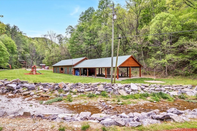3178 N Clear Fork Rd, Sevierville, TN 37862 - exterior space featuring a view of trees and a front yard