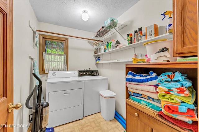 3178 N Clear Fork Rd, Sevierville, TN 37862 - laundry room featuring laundry area, a textured ceiling, brick patterned floor, and washer and dryer