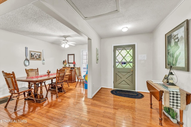 3178 N Clear Fork Rd, Sevierville, TN 37862 - foyer with visible vents, baseboards, light wood-type flooring, a textured ceiling, and a ceiling fan