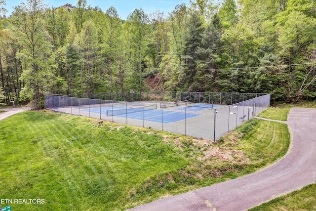 3178 N Clear Fork Rd, Sevierville, TN 37862 - view of sport court with fence, a yard, and a forest view