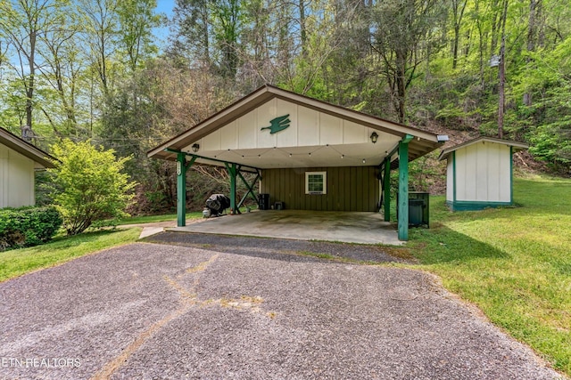 3178 N Clear Fork Rd, Sevierville, TN 37862 - view of front of home with a front lawn, a storage shed, an outbuilding, a carport, and driveway