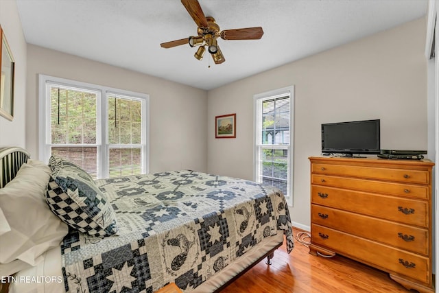 3178 N Clear Fork Rd, Sevierville, TN 37862 - bedroom featuring light wood-style floors, baseboards, and ceiling fan