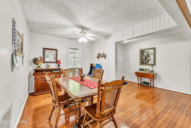 3178 N Clear Fork Rd, Sevierville, TN 37862 - dining room with a ceiling fan, a textured ceiling, baseboards, and light wood-type flooring