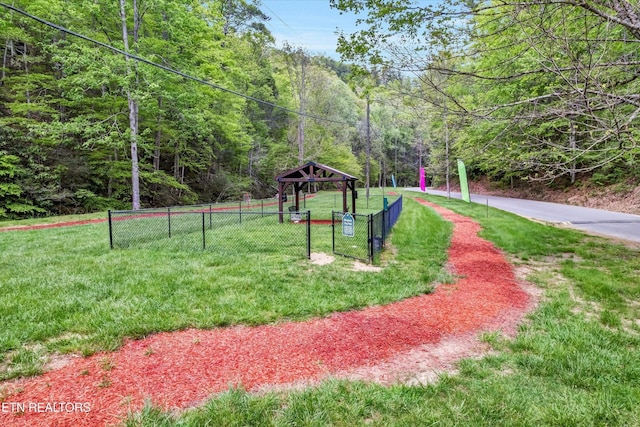 3178 N Clear Fork Rd, Sevierville, TN 37862 - view of community featuring a lawn, fence, and a forest view