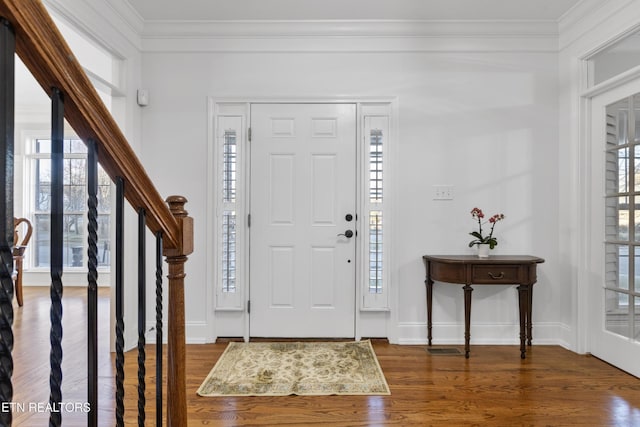 entrance foyer with plenty of natural light and crown molding
