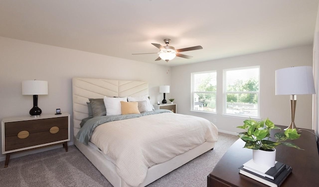 carpeted bedroom with baseboards and ceiling fan