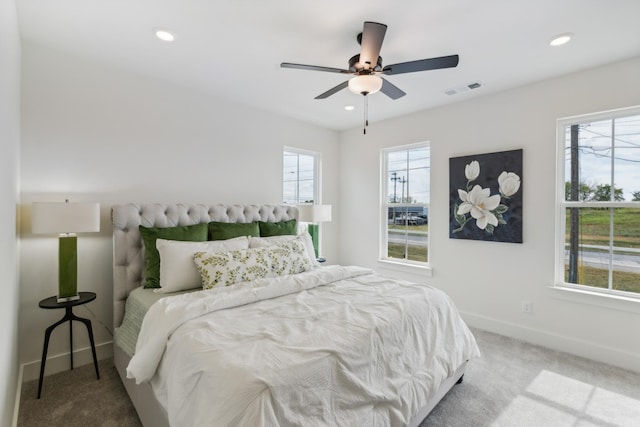 carpeted bedroom featuring visible vents, recessed lighting, baseboards, and a ceiling fan