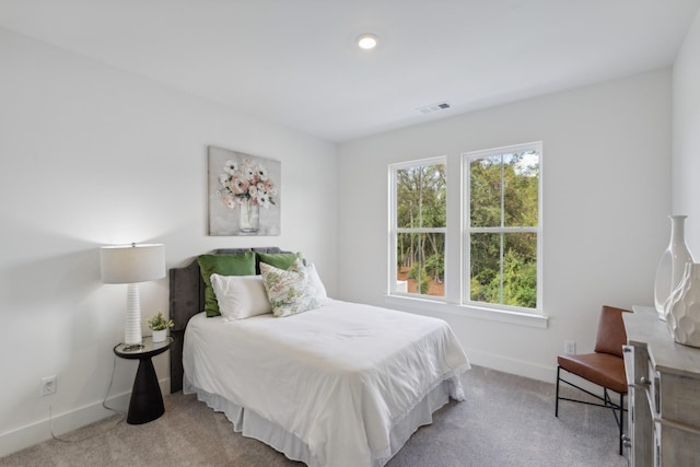 carpeted bedroom with baseboards, recessed lighting, and visible vents