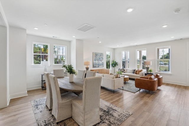 dining room with recessed lighting, baseboards, visible vents, and light wood-type flooring