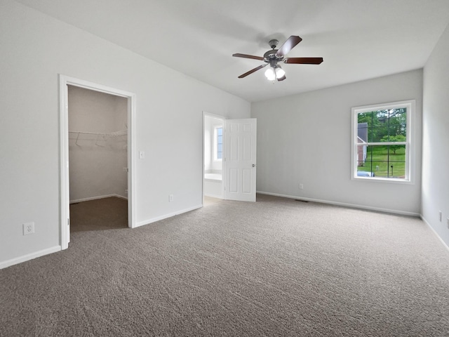 4013 Kristen St, Spring Hill, TN 37174 - unfurnished bedroom with baseboards, visible vents, a walk in closet, and carpet