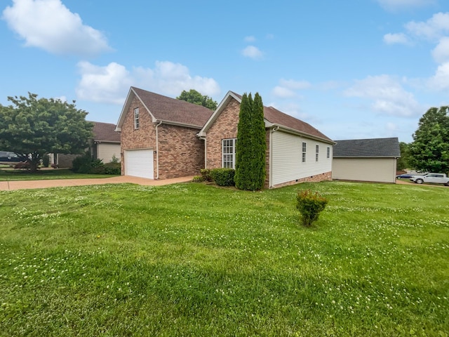 4013 Kristen St, Spring Hill, TN 37174 - view of home's exterior featuring a lawn, concrete driveway, a garage, and brick siding