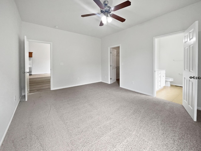 4013 Kristen St, Spring Hill, TN 37174 - unfurnished bedroom with connected bathroom, ceiling fan, carpet, baseboards, and a spacious closet