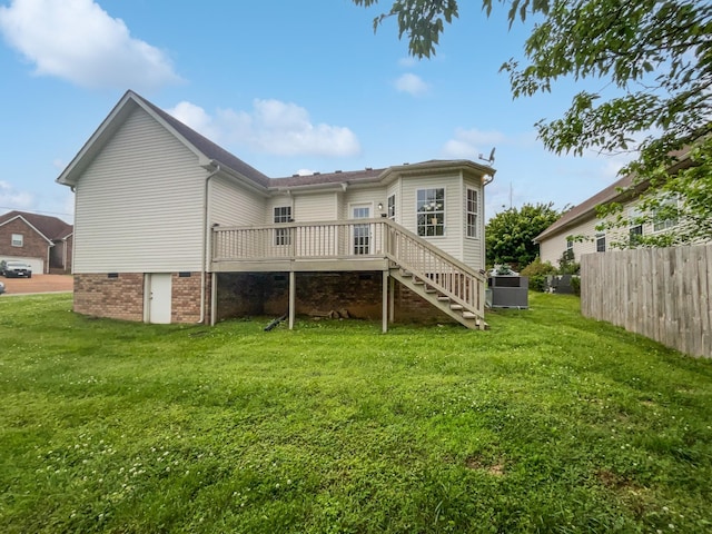 4013 Kristen St, Spring Hill, TN 37174 - back of property with a yard, fence, a wooden deck, and stairs