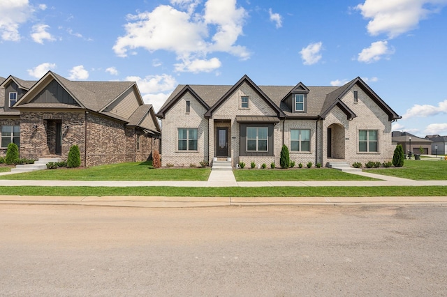 104 Nelson St, Gallatin, TN 37066 - view of front facade with a front yard and brick siding