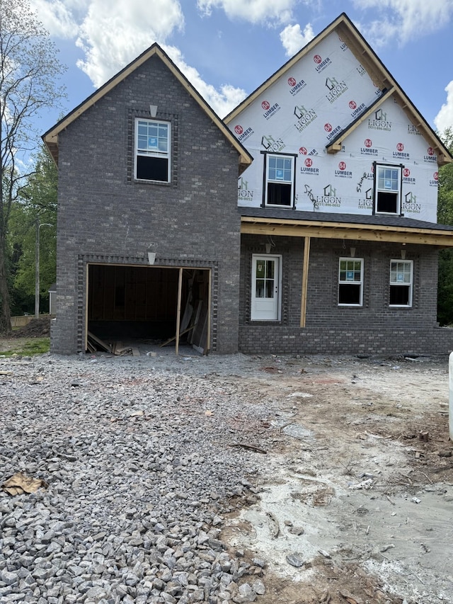 615 Guildfield Dr, Clarksville, TN 37043 - view of front facade featuring an attached garage, brick siding, and driveway