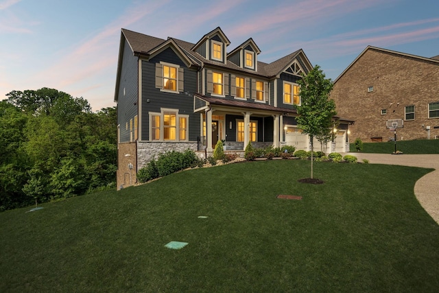 5017 Great Falls Ct, College Grove, TN 37046 - craftsman house with concrete driveway, covered porch, stone siding, a lawn, and a garage