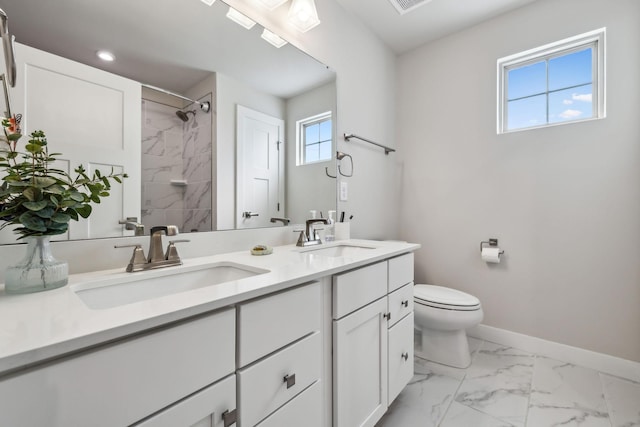 5017 Great Falls Ct, College Grove, TN 37046 - full bath featuring toilet, baseboards, a tile shower, marble look tiles, and double vanity