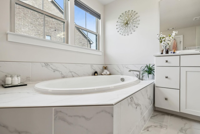 5017 Great Falls Ct, College Grove, TN 37046 - full bath featuring marble finish floors, vanity, and a bath