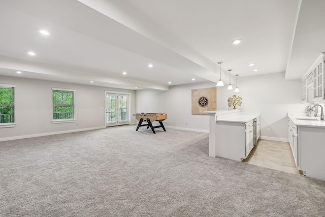 5017 Great Falls Ct, College Grove, TN 37046 - kitchen featuring a sink, recessed lighting, light carpet, baseboards, and light countertops