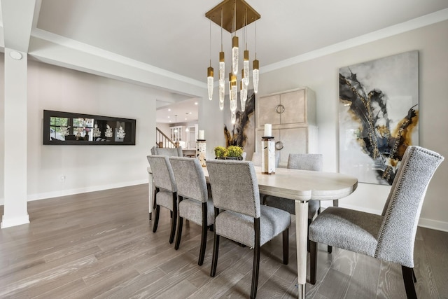 5017 Great Falls Ct, College Grove, TN 37046 - dining area featuring a chandelier, crown molding, wood finished floors, and baseboards