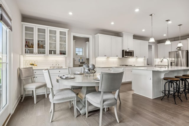 5017 Great Falls Ct, College Grove, TN 37046 - kitchen featuring appliances with stainless steel finishes, a center island with sink, a sink, decorative backsplash, and recessed lighting