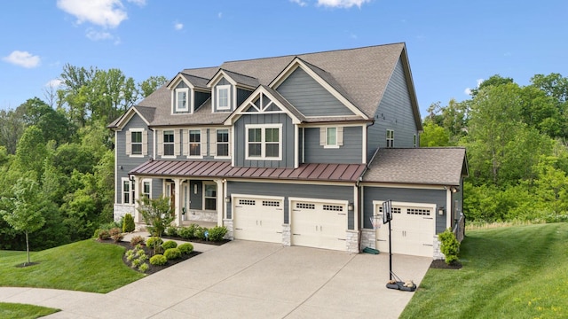 5017 Great Falls Ct, College Grove, TN 37046 - craftsman-style house with stone siding, concrete driveway, board and batten siding, a front lawn, and a standing seam roof
