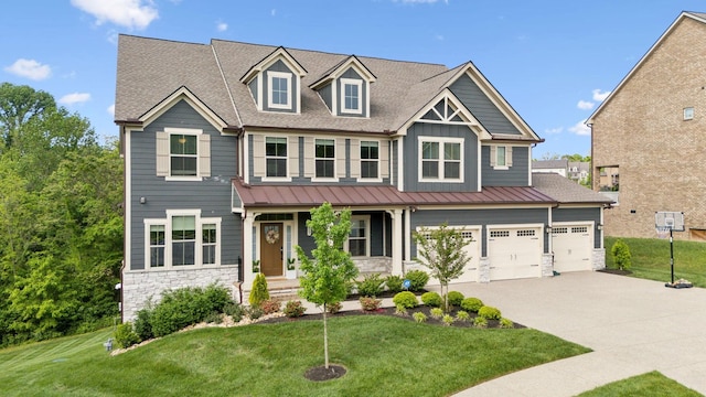 5017 Great Falls Ct, College Grove, TN 37046 - craftsman-style house featuring stone siding, driveway, a front lawn, board and batten siding, and a standing seam roof
