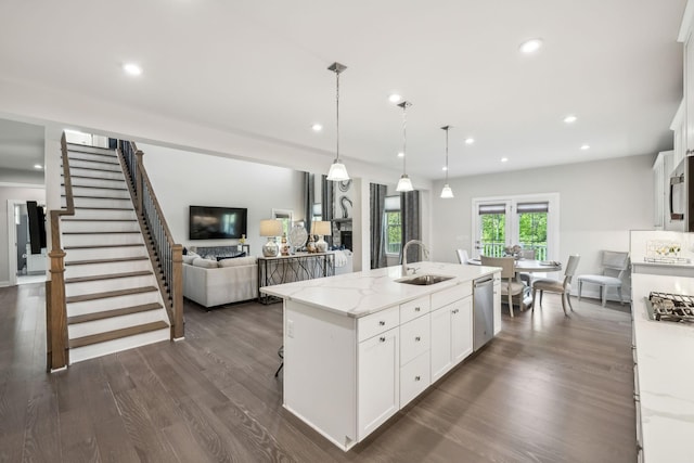 5017 Great Falls Ct, College Grove, TN 37046 - kitchen with appliances with stainless steel finishes, a sink, dark wood finished floors, white cabinetry, and recessed lighting