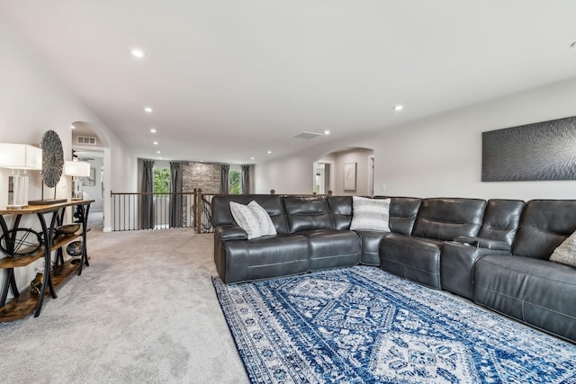 5017 Great Falls Ct, College Grove, TN 37046 - living area featuring arched walkways, carpet flooring, and recessed lighting