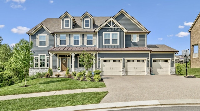 5017 Great Falls Ct, College Grove, TN 37046 - craftsman-style house featuring stone siding, asphalt driveway, a standing seam roof, a front yard, and an attached garage