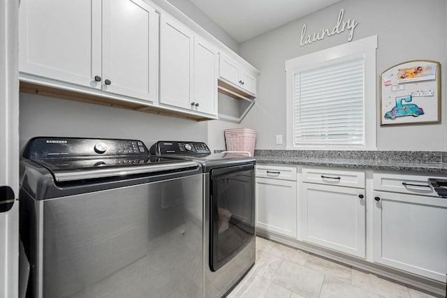 3420 Caroline Farms Dr, Murfreesboro, TN 37129 - laundry room with washing machine and clothes dryer, cabinet space, and light tile patterned floors