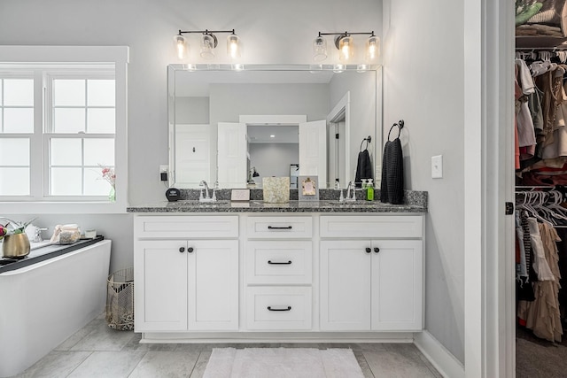 3420 Caroline Farms Dr, Murfreesboro, TN 37129 - full bathroom featuring double vanity, a spacious closet, and a freestanding bath