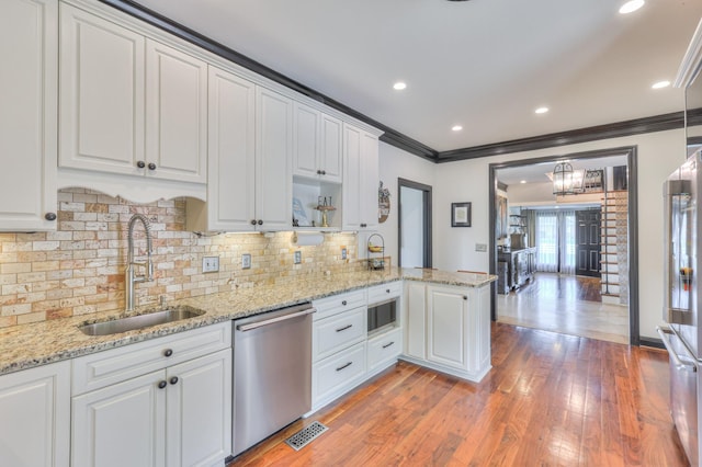 107 Churchill Farms Dr, Murfreesboro, TN 37127 - kitchen with backsplash, a sink, ornamental molding, stainless steel appliances, and white cabinetry