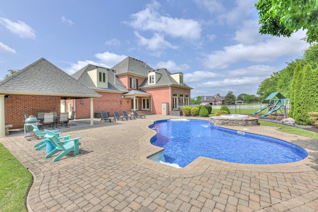 107 Churchill Farms Dr, Murfreesboro, TN 37127 - view of pool featuring a playground, a pool with connected hot tub, fence, and a patio area