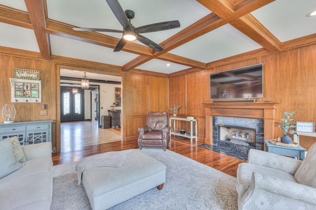107 Churchill Farms Dr, Murfreesboro, TN 37127 - living area with a high end fireplace, beamed ceiling, ceiling fan with notable chandelier, wooden walls, and coffered ceiling