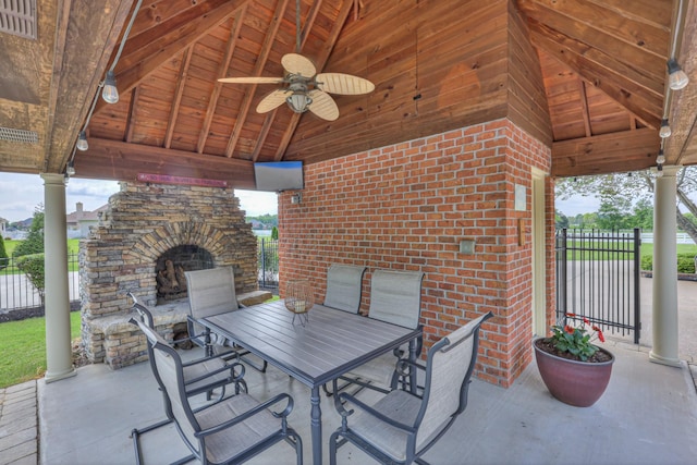 107 Churchill Farms Dr, Murfreesboro, TN 37127 - view of patio featuring fence, a ceiling fan, outdoor dining area, and an outdoor stone fireplace