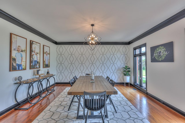 107 Churchill Farms Dr, Murfreesboro, TN 37127 - dining area featuring crown molding, a notable chandelier, an accent wall, baseboards, and wood finished floors