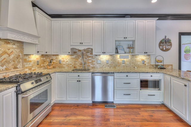 107 Churchill Farms Dr, Murfreesboro, TN 37127 - kitchen featuring recessed lighting, custom range hood, a sink, appliances with stainless steel finishes, and backsplash