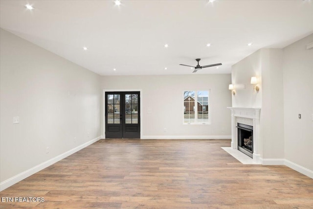 1983 Kaylee Dr, Jefferson City, TN 37760 - unfurnished living room featuring baseboards, ceiling fan, wood finished floors, and a premium fireplace