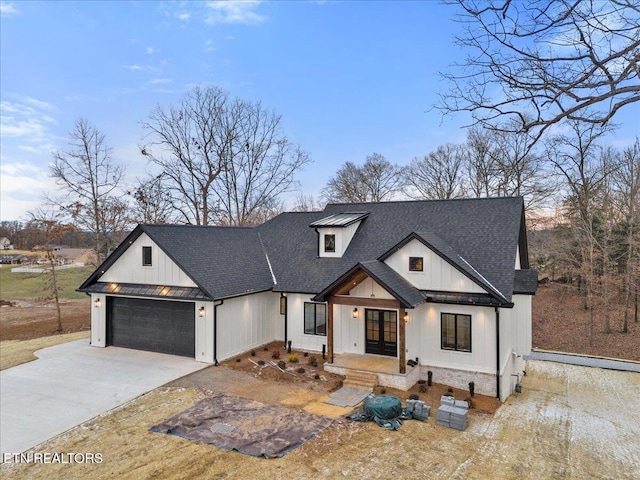 1983 Kaylee Dr, Jefferson City, TN 37760 - modern inspired farmhouse with a shingled roof, an attached garage, board and batten siding, french doors, and driveway