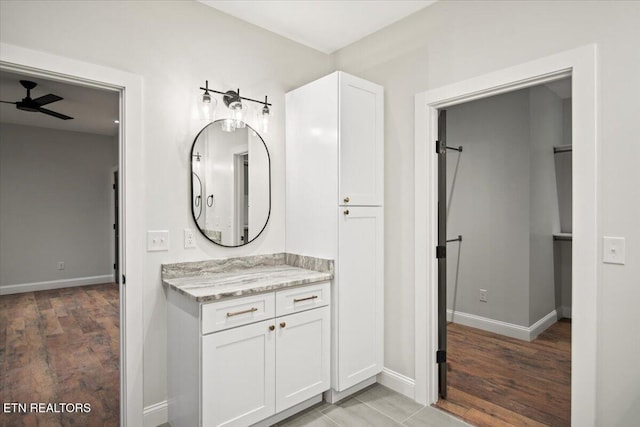 1983 Kaylee Dr, Jefferson City, TN 37760 - bathroom with baseboards, ceiling fan, wood finished floors, and vanity