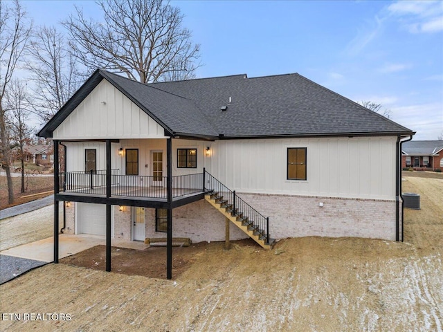 1983 Kaylee Dr, Jefferson City, TN 37760 - rear view of house featuring brick siding, a shingled roof, stairs, and a garage
