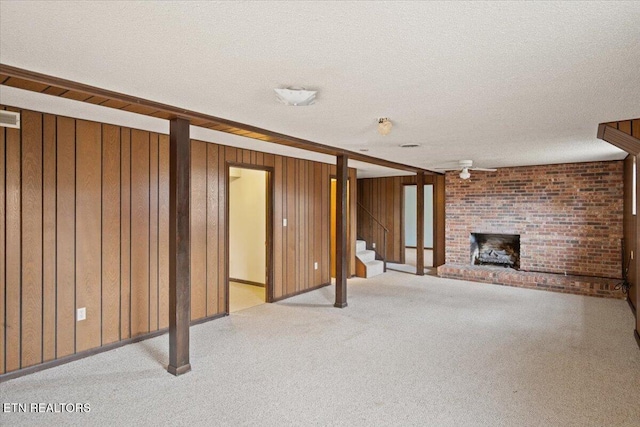716 Lakewood Dr, Jefferson City, TN 37760 - unfurnished living room with stairs, a textured ceiling, carpet, and a fireplace