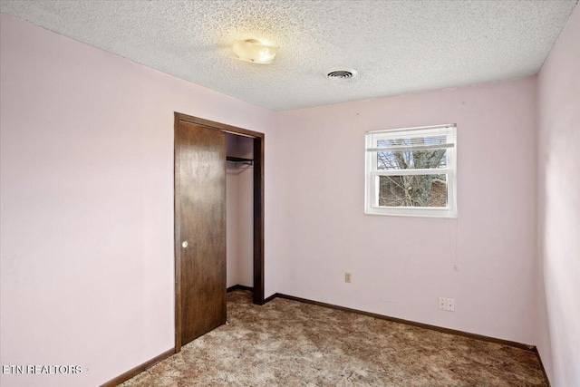 716 Lakewood Dr, Jefferson City, TN 37760 - unfurnished bedroom featuring a textured ceiling, carpet, baseboards, visible vents, and a closet